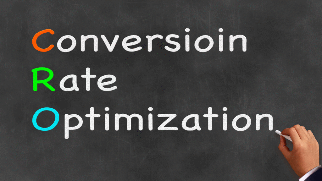 A hand writing "Conversion Rate Optimization" on a chalkboard, with the acronym "CRO" highlighted in orange, green, and blue letters.