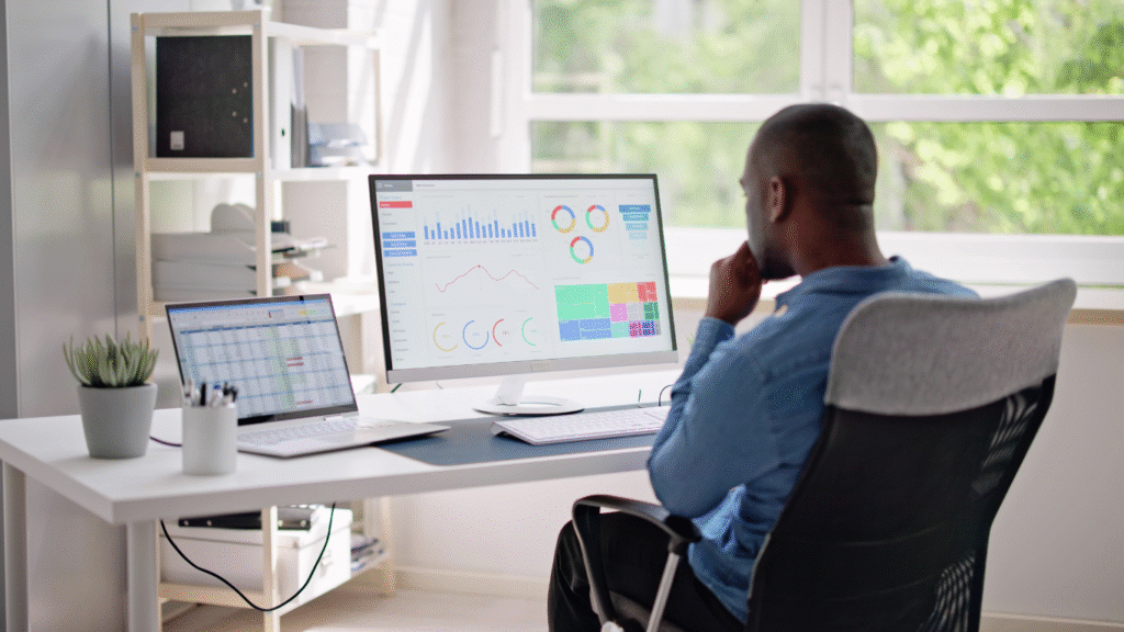 A marketing expert at a desk analyzing a website's Core Web Vitals and performance data on a large computer monitor, identifying speed issues.