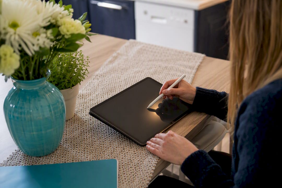 Hands editing citation data on tablet